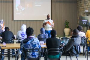 Facilitator standing in front of participants during a training session in Industrial Area.